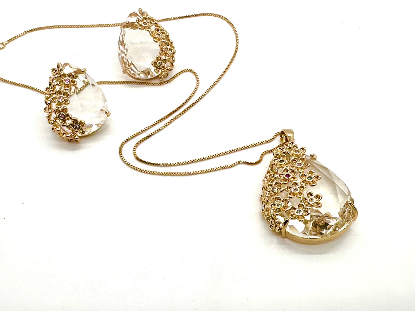 Crystal and Flowers - Set necklace and earrings adorned with flowers applied over crystal pendants.