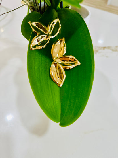 Petals - plated 18k gols hammered gold earrings shaped like flower petals.